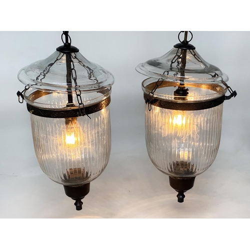 104 - BELL JAR HALL LANTERNS, a pair, glass reeded tapering and bronze style mounted, 58cm H x 34cm W. (2)