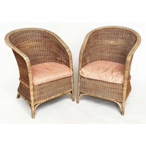 118 - CONSERVATORY ARMCHAIRS BY DRYAD, a pair, rattan and cane woven, with arched back and seat cushions, ... 