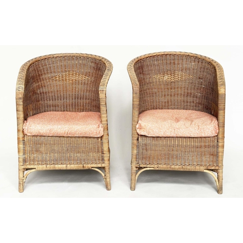 118 - CONSERVATORY ARMCHAIRS BY DRYAD, a pair, rattan and cane woven, with arched back and seat cushions, ... 