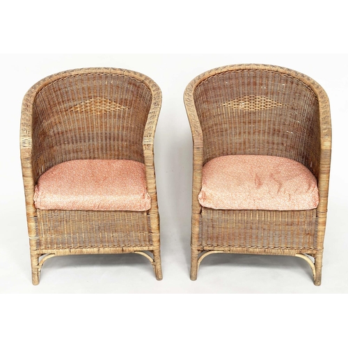 118 - CONSERVATORY ARMCHAIRS BY DRYAD, a pair, rattan and cane woven, with arched back and seat cushions, ... 