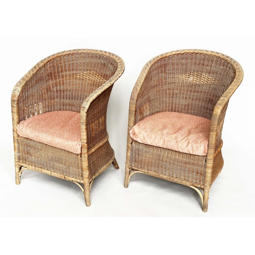 118 - CONSERVATORY ARMCHAIRS BY DRYAD, a pair, rattan and cane woven, with arched back and seat cushions, ... 