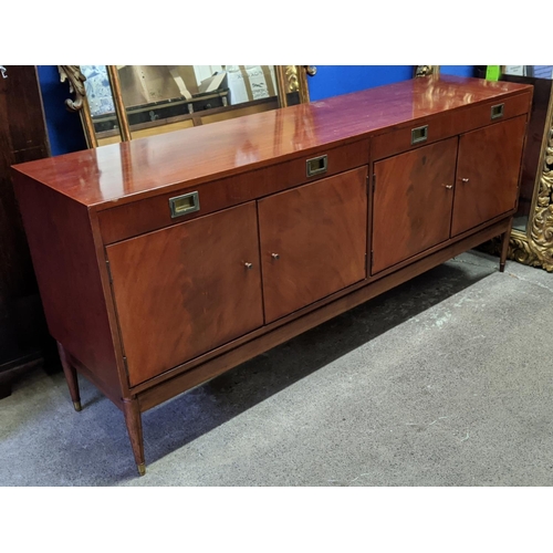 133 - SIDEBOARD, mid-century teak with two drawers above two cupboards, raised on brass caped tapered supp... 