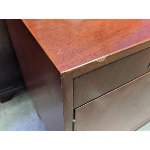 133 - SIDEBOARD, mid-century teak with two drawers above two cupboards, raised on brass caped tapered supp... 