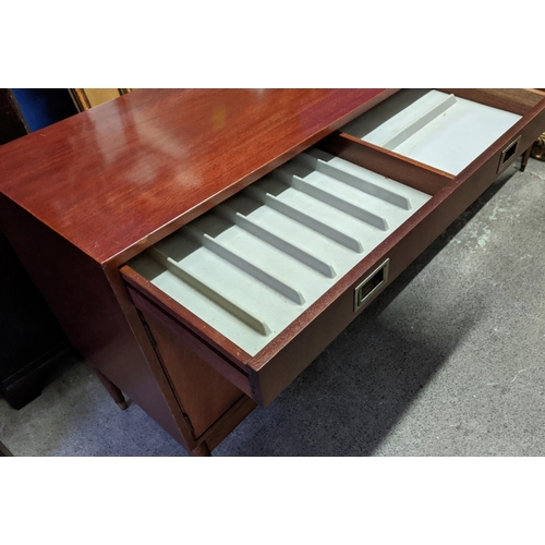 133 - SIDEBOARD, mid-century teak with two drawers above two cupboards, raised on brass caped tapered supp... 