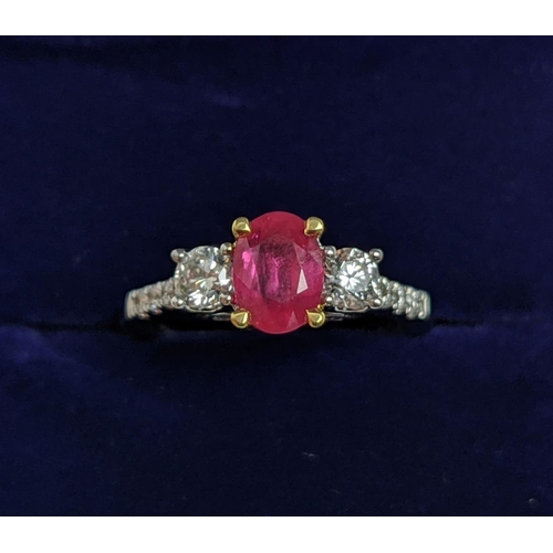 15 - AN 18CT WHITE GOLD RUBY AND DIAMOND TRILOGY RING, the central ruby stone of approx. 0.89 carat, diam... 