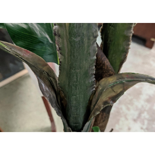 392 - FAUX BANANA PALMS, a pair, in painted metal containers, 177cm H at tallest approx. (2)