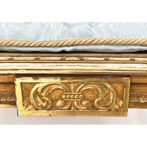 453 - WINDOW SEAT, early 20th century French transitional style giltwood of kidney form with cane seat and... 