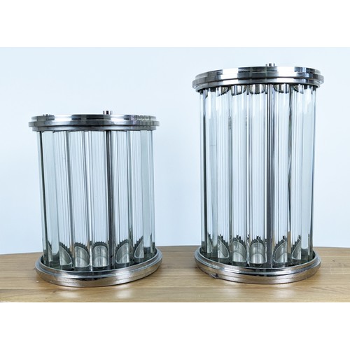 406 - STORM LANTERNS, a graduated pair, polished metal, with glass rods, 40.5cm x 26.5cm diam. at largest.... 