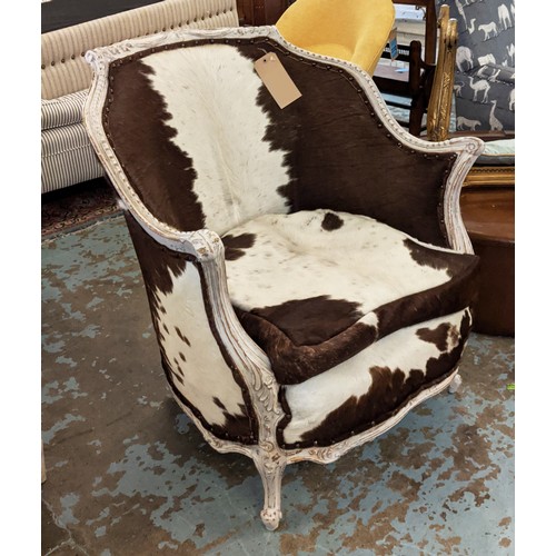 271 - BERGERE ARMCHAIR, in cowskin upholstery with carved distressed painted showframe, 80cm W.