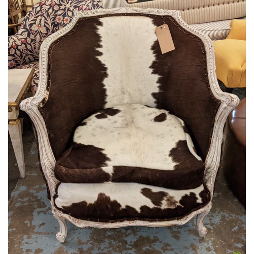 271 - BERGERE ARMCHAIR, in cowskin upholstery with carved distressed painted showframe, 80cm W.