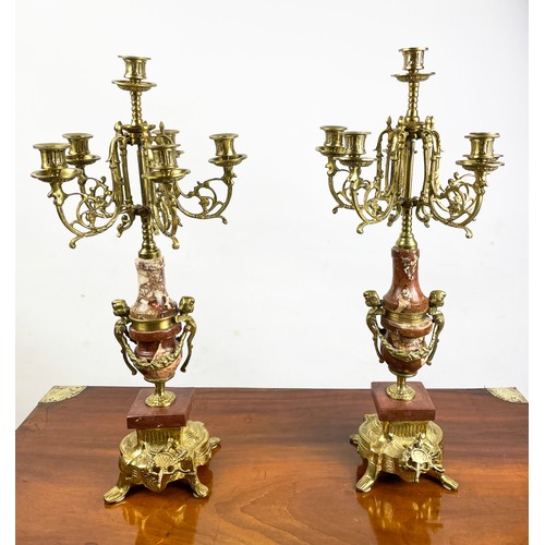 34 - CANDELABRA, a pair, Italian 'brevettato', brass and marble with figural cherubs. (2)