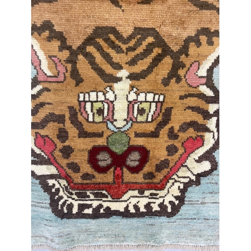 192 - FINE TIBETAN TIGER CARPET, 297cm x 200cm.