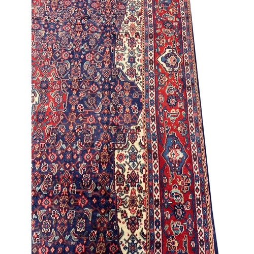 207 - FINE PERSIAN TABRIZ HERATI DESIGN CARPET, 315cm x 222cm.