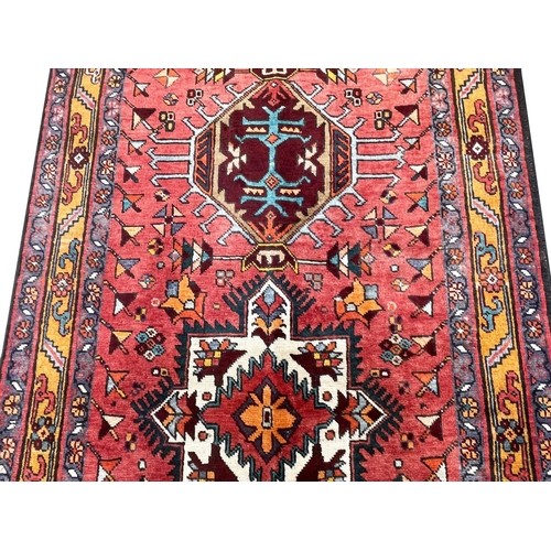 214 - PERSIAN HERIZ RUNNER, 350cm x 105cm.