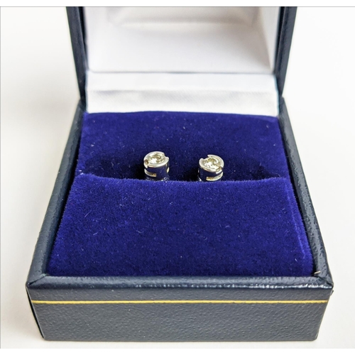 22 - A PAIR OF 9CT WHITE GOLD DIAMOND SOLITARE STUDS, each diamond with an approx weight of 0.16 carats, ... 