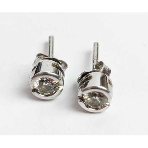 22 - A PAIR OF 9CT WHITE GOLD DIAMOND SOLITARE STUDS, each diamond with an approx weight of 0.16 carats, ... 