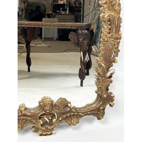 223 - WALL MIRROR, in the Brighton Pavillion manner, giltwood and gesso pagoda design frame, 118cm x 81cm.