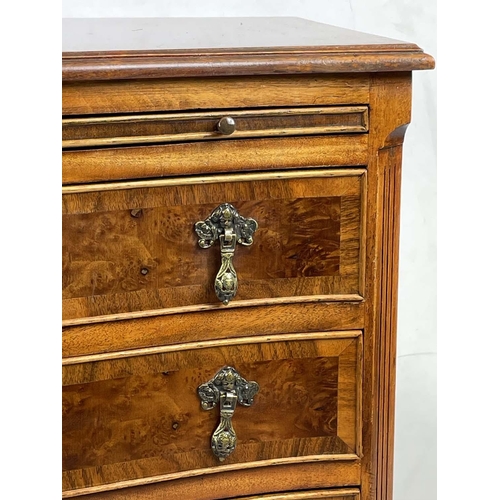 228 - BACHELOR'S SERPENTINE CHEST, 18th century style burr amboyna top with mahogany banding,  above green... 