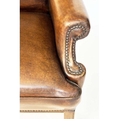 260 - WING ARMCHAIR, early George III design mahogany with brass studded naturally faded mid brown leather... 