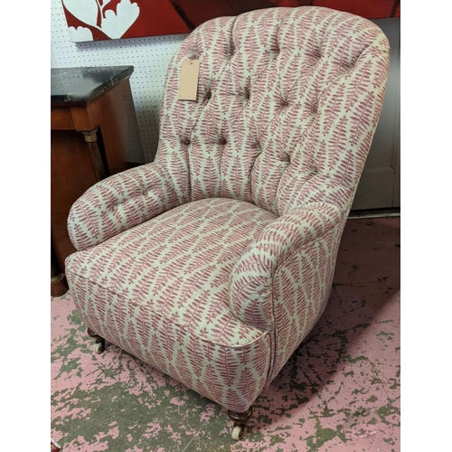 295 - ARMCHAIR, Victorian button back with turned front supports and castors, 93cm H x 69cm W.