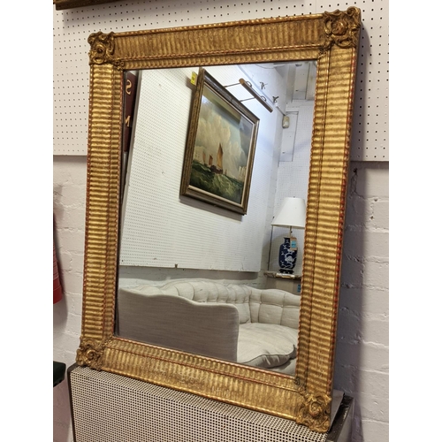 344 - LOUIS PHILIPPE GILTWOOD WALL MIRROR, gesso applied decoration, 94cm x 73.5cm