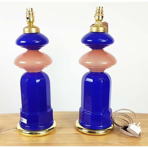 418 - CENEDESE MURANO GLASS TABLE LAMPS, a pair, cobalt blue and rose pink opaline glass, on brass bases, ... 