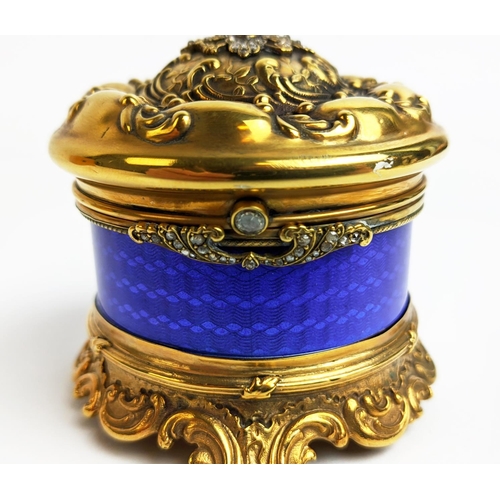 5 - A FABERGE SILVER GILT AND BLUE ENAMELLED CIRCULAR BOX, embossed lid set with ruby and diamonds, with... 