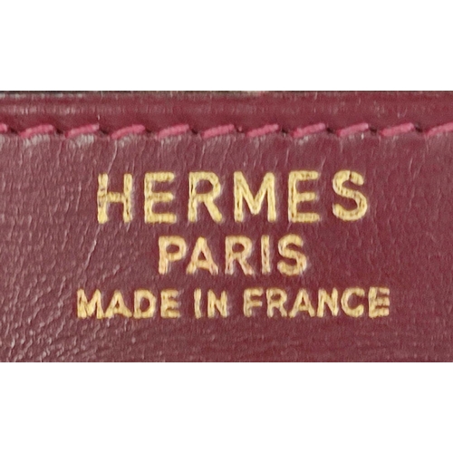 71 - HERMÈS KELLY RETOURNE 32 TOILE/VEAU BOX, gold tone hardware, top handle, color matching leather lini... 