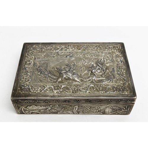 43 - A BURMESE WHITE METAL BOWL AND COVER, late 19th / early 20th Century, embossed with figures in lands... 