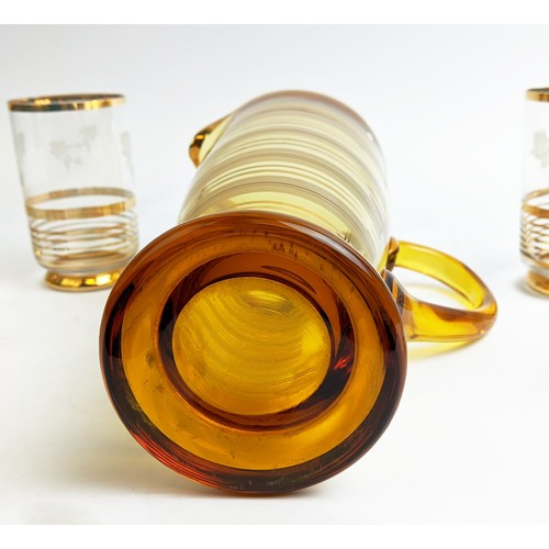 45 - A MID 20TH CENTURY ITALIAN AMBER COLOURED WINE JUG, and six beakers, the beakers with grapevine deco... 