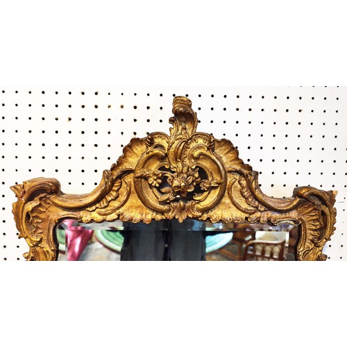 345 - ROCOCCO REVIVAL GILTWOOD WALL MIRROR, 19th century, with acanthus scrolling frame, bevelled edge mir... 