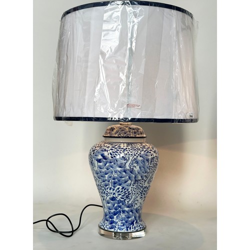 257 - TABLE LAMPS, a pair large Chinese blue and white ceramic of lidded vase form with lucite bases and s... 