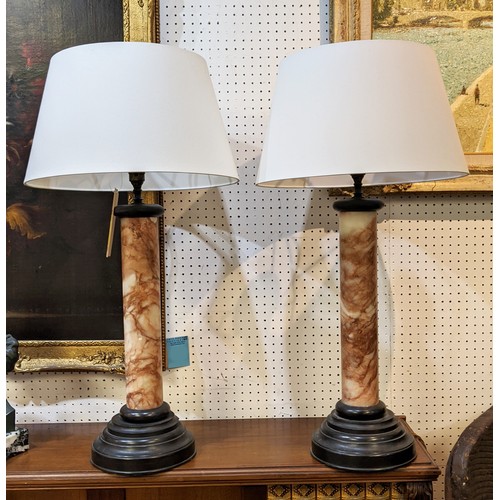 10 - COLUMN LAMPS, a pair, circa 1920s, grand tour style alabaster column form with stepped bronze bases ... 