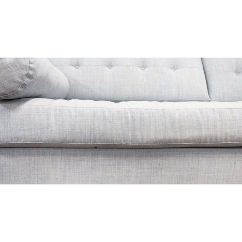 642 - FOGIA ALEX SOFA,230cm W x 91cm D, in light blue fabric with a buttoned back and metal supports.