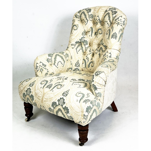 215 - ARMCHAIR, Victorian button back upholstered with turned mahogany legs and ceramic front castors, 85c... 