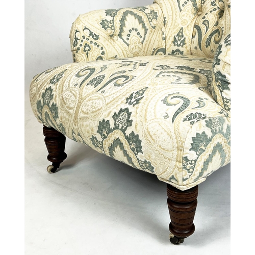 215 - ARMCHAIR, Victorian button back upholstered with turned mahogany legs and ceramic front castors, 85c... 