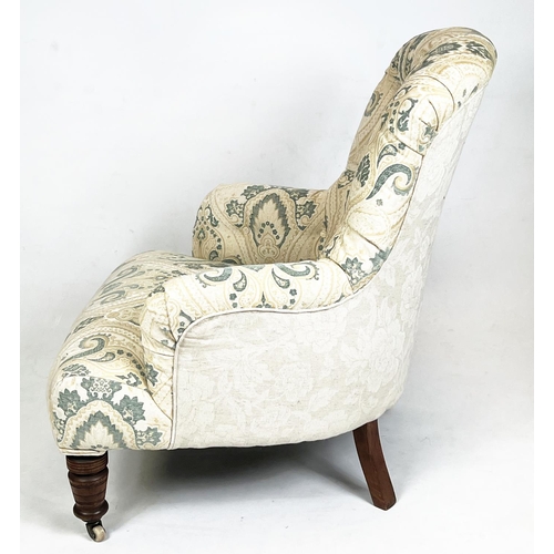 215 - ARMCHAIR, Victorian button back upholstered with turned mahogany legs and ceramic front castors, 85c... 