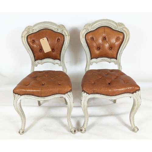 156 - DINING CHAIRS, a set of six, with distressed painted carved showframes and stuffover leather buttone... 