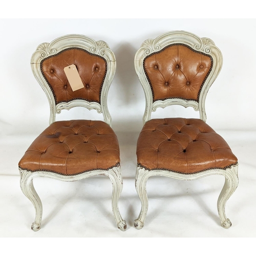 156 - DINING CHAIRS, a set of six, with distressed painted carved showframes and stuffover leather buttone... 