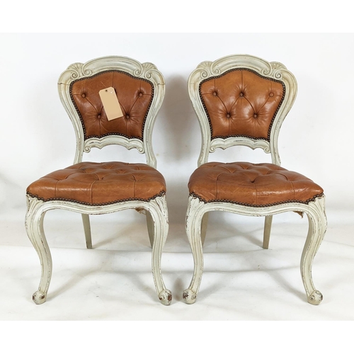 156 - DINING CHAIRS, a set of six, with distressed painted carved showframes and stuffover leather buttone... 