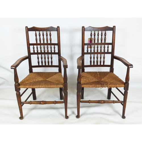 402 - SPINDLE BACK CHAIRS, a set of six, including two carvers, 19th century oak with rush seats, carvers ... 