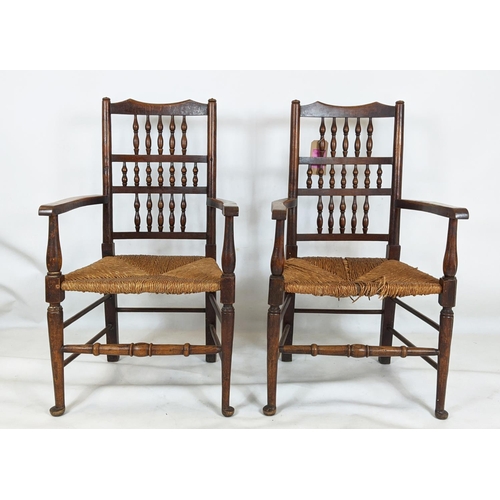 402 - SPINDLE BACK CHAIRS, a set of six, including two carvers, 19th century oak with rush seats, carvers ... 