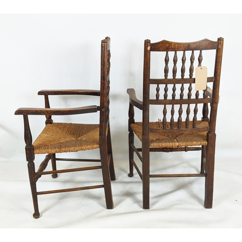 402 - SPINDLE BACK CHAIRS, a set of six, including two carvers, 19th century oak with rush seats, carvers ... 