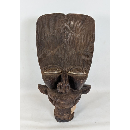 9 - BAMILEKE BATCHAM JANUS STOOL (Cameroon), 105cm H x 6cm W x 55cm D.