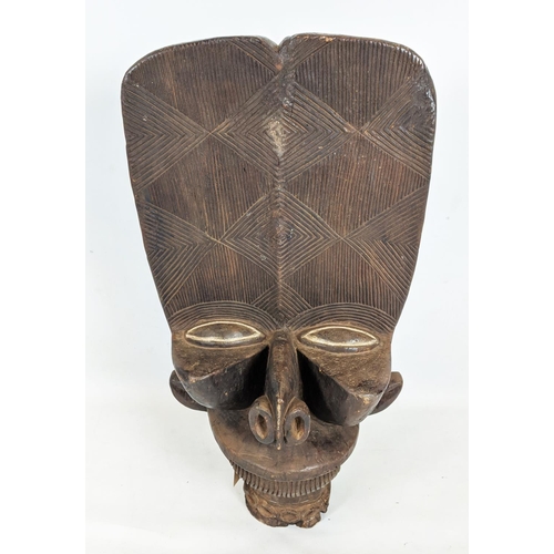 9 - BAMILEKE BATCHAM JANUS STOOL (Cameroon), 105cm H x 6cm W x 55cm D.