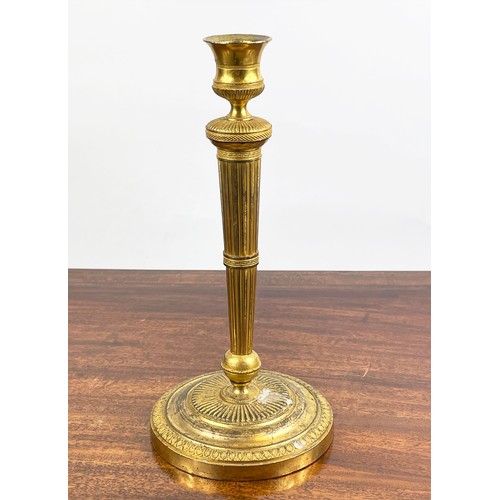 12 - CANDLESTICKS, a near pair, 19th century gilt brass, 27cm H. (2)