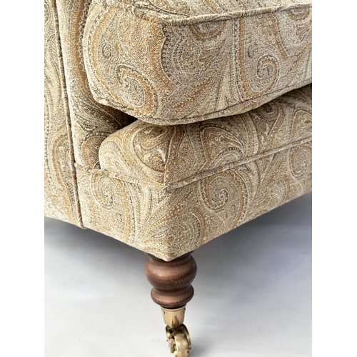 106 - ARMCHAIR, Howard style with Paisley style upholstery and turned front supports, 86cm W.