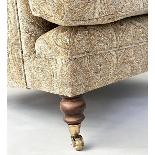 106 - ARMCHAIR, Howard style with Paisley style upholstery and turned front supports, 86cm W.