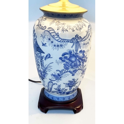 108 - TABLE LAMPS, a pair, Chinese ceramic blue and white toile print, of vase form with wooden bases and ... 