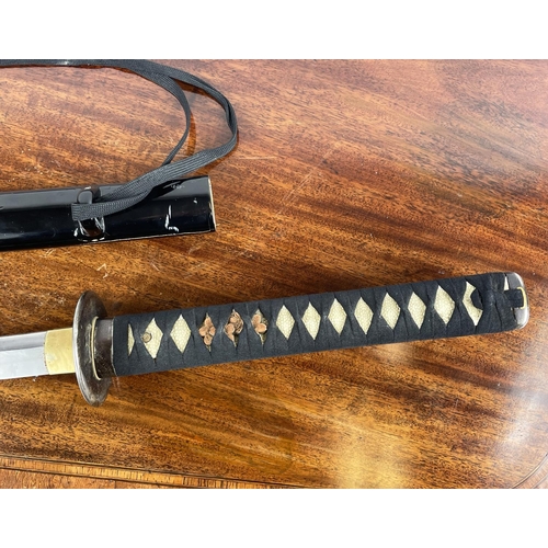 11 - SAMURAI SWORD 'KATANA', with shagreen style grip and black lacquer sheath, 105cm L.